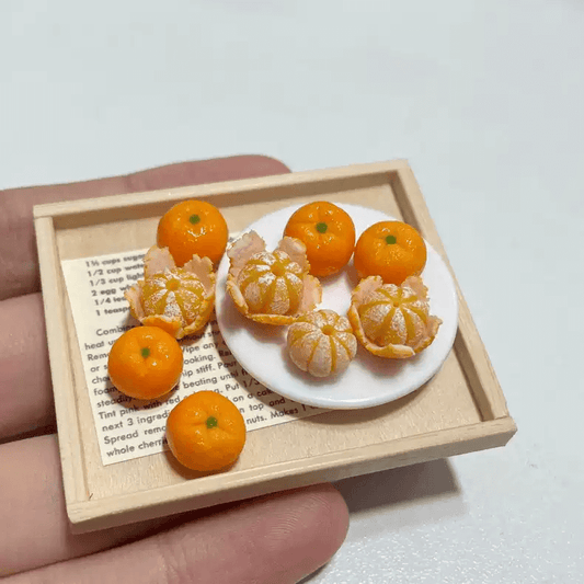 Miniature fruit mandarin for a dollhouse. Miniature fruit mandarin made of clay. Miniature fruit mandarin in 1/6 scale can be used in doll kitchen, doll grocery store, doll food, collection, diorama decoration.