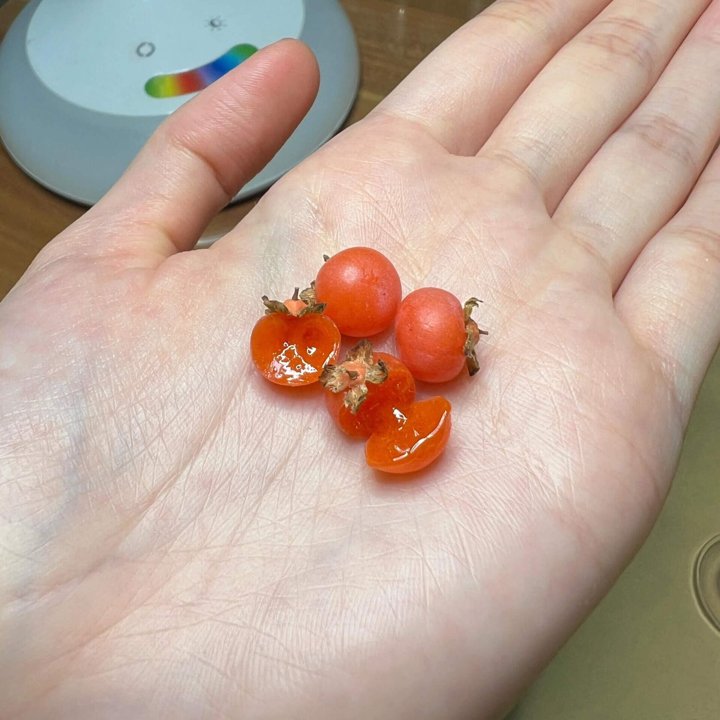 Miniature fruit persimmon for a dollhouse. Miniature fruit persimmon made of clay. Miniature fruit persimmon can be used in doll kitchen, doll grocery store, doll food, collection, diorama decoration.