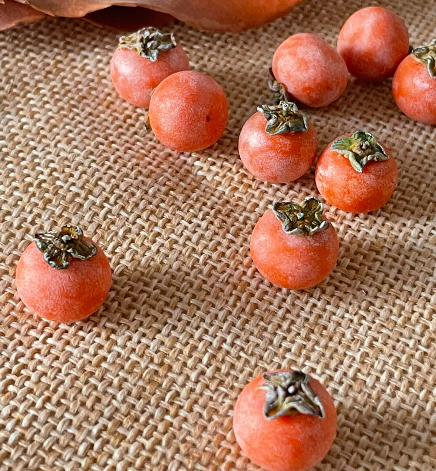 Miniature fruit persimmon for a dollhouse. Miniature fruit persimmon made of clay. Miniature fruit persimmon can be used in doll kitchen, doll grocery store, doll food, collection, diorama decoration.