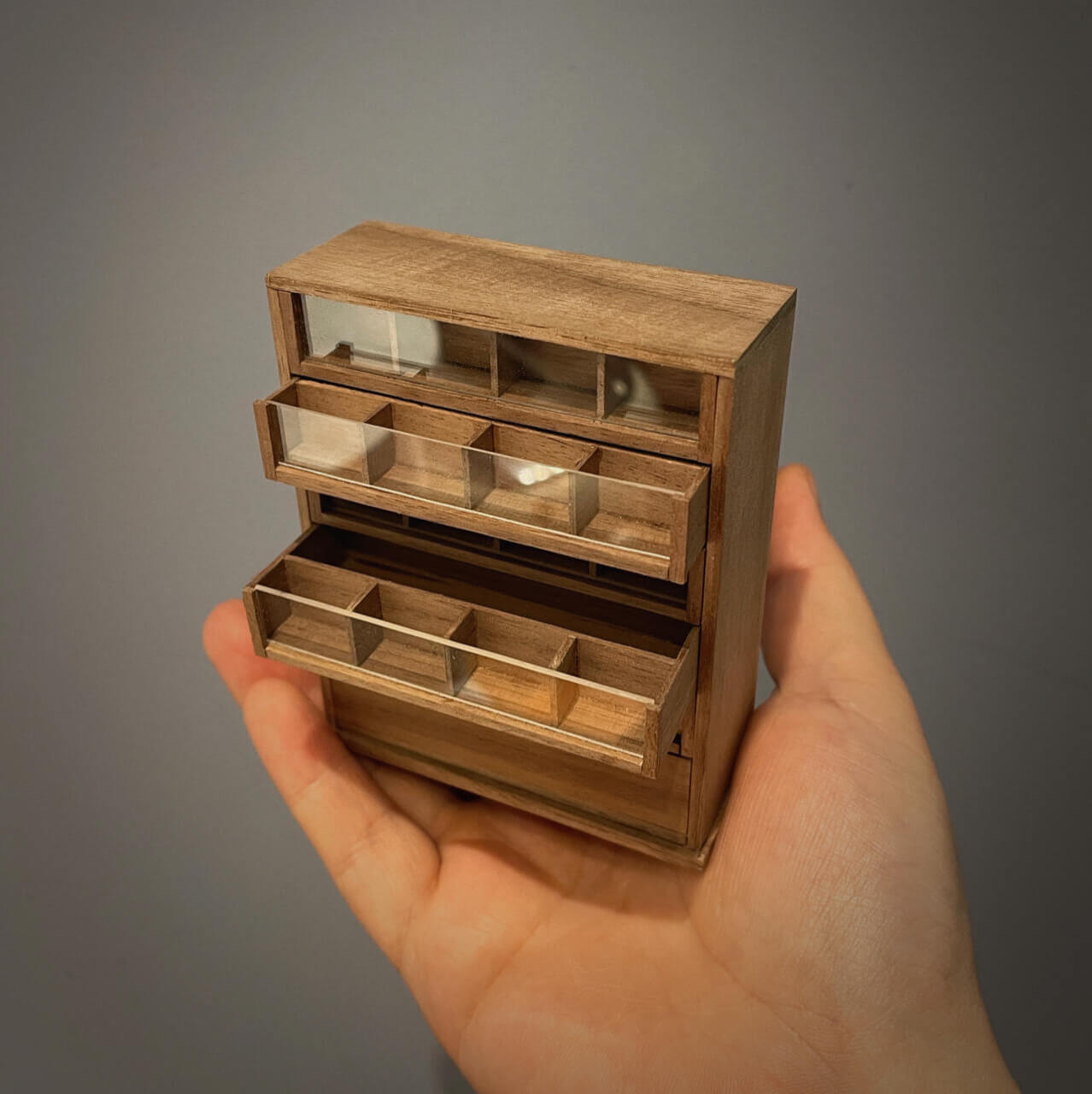 Spool cabinets are charming and functional pieces of antique furniture that were once used to store sewing thread spools. Default Color/ Finish: Cherry wood or Dark walnut Material: Black Walnut wood or Cherry wood Scale: 1/12 (4.1×1.7×5cm / 1.61×0.67×1.97in); 1/6 (7×2.7×8.2cm / 2.76×1.06×3.23in).