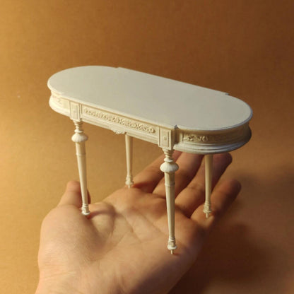 The White Miniature Oval-shaped Dining Coffee Table Dollhouse Furniture is made of Resin with an expression linked to elegance and craftsmanship. Subtle carved details Color/ Finish: White Styles: A classic French inspired design Material: Resin Type: Table Height: 11cm/4.33in