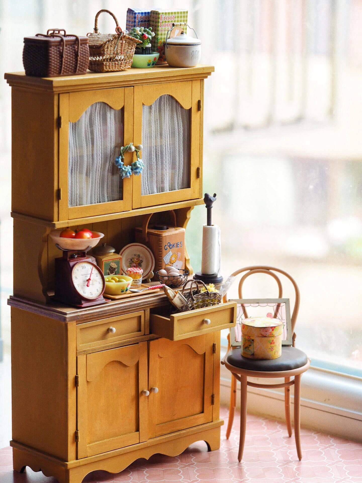 Bring a charming vintage feel to your dollhouse kitchen with this Miniature Wooden Kitchen Pantry Hutch Cupboard Kit. This beautifully designed cupboard features two doors that reveal open shelves, perfect for displaying miniature kitchenware. The lower section includes multiple drawers and cabinet space for storing tiny items, offering both functionality and a cozy aesthetic. Its warm wood finish and elegant detailing make it a perfect addition to any miniature kitchen or dining room.