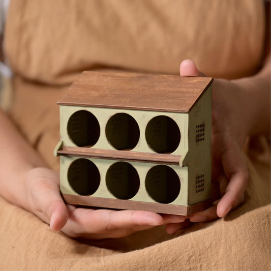 Add a whimsical, nature-inspired touch to your dollhouse with this Miniature Wooden Bird Nest Shaped Storage Cabinet Kit. Designed in the shape of a bird's nest, this charming storage unit features 6 circular compartments, perfect for organizing small items like flower pots, craft supplies, or tiny collectibles. Its rustic, nature-inspired design makes it an ideal addition to any miniature garden or whimsical setting.
