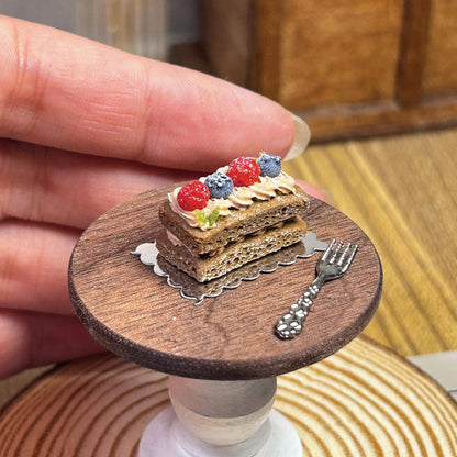 Handmade, each piece is unique! The real thing is super beautiful and cute. Perfect for decorating dollhouses of all sizes! Size: 2cm / 0.79in This set includes a miniature clay berry chocolate cream brownie, a miniature ceramic plate, and a random fork or spoon.