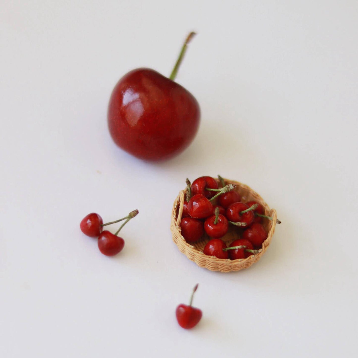 Miniature fruit cherry for a dollhouse. Miniature fruit cherry made of clay. Miniature fruit cherry in 1/6 scale can be used in doll kitchen, doll grocery store, doll food, collection, diorama decoration. Size: 0.5cm / 0.2in