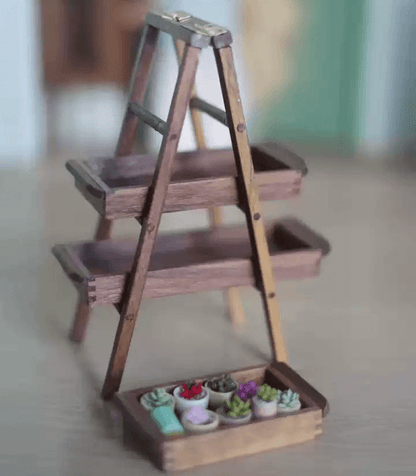 Miniature rustic walnut A-frame shelving unit with removeable trays. Perfect for dollhouse and garden use as a display stand for ornaments or flower and plants. Perfect for a moern or more traditional home decor look.