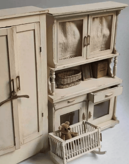 Add a touch of vintage elegance to your dollhouse with this Miniature Shabby Chic Kitchen Sideboard Cupboard Dresser Cabinet Kit. This beautifully crafted piece combines a charming sideboard with a cupboard and dresser, offering both display and storage options. The cabinet features doors for showcasing small items, while the lower section includes drawers for organizing your mini treasures.