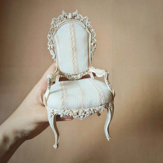 Miniature Shabby Chic White Hand Painted Throne Carved Arm Chair, with a carved has amazing detail! Fit for any dollhouse king or queen. Color/ Finish: White Styles: Vintage Shabby Chic Material: Resin Type: Arm Chair Scale: 1/12; 1/6; 1/4; 1/3.