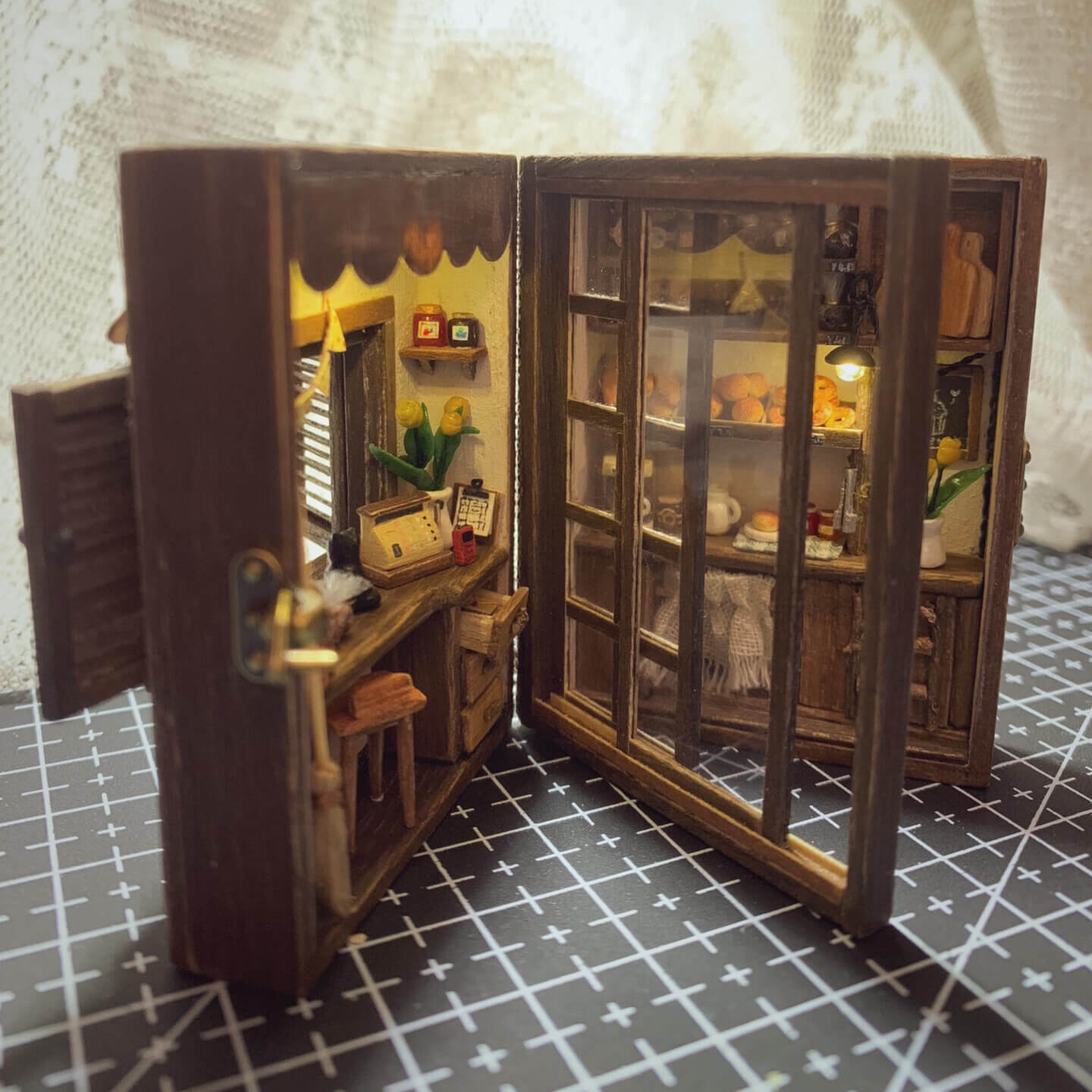 Inspired by "Kiki's Delivery Service" "I’m not quite sure of my direction, but I hope I can go a little further." — "Kiki's Delivery Service" Can be opened, flipped through, and has lights; all small items can be removed. Louvered windows and sliding doors.