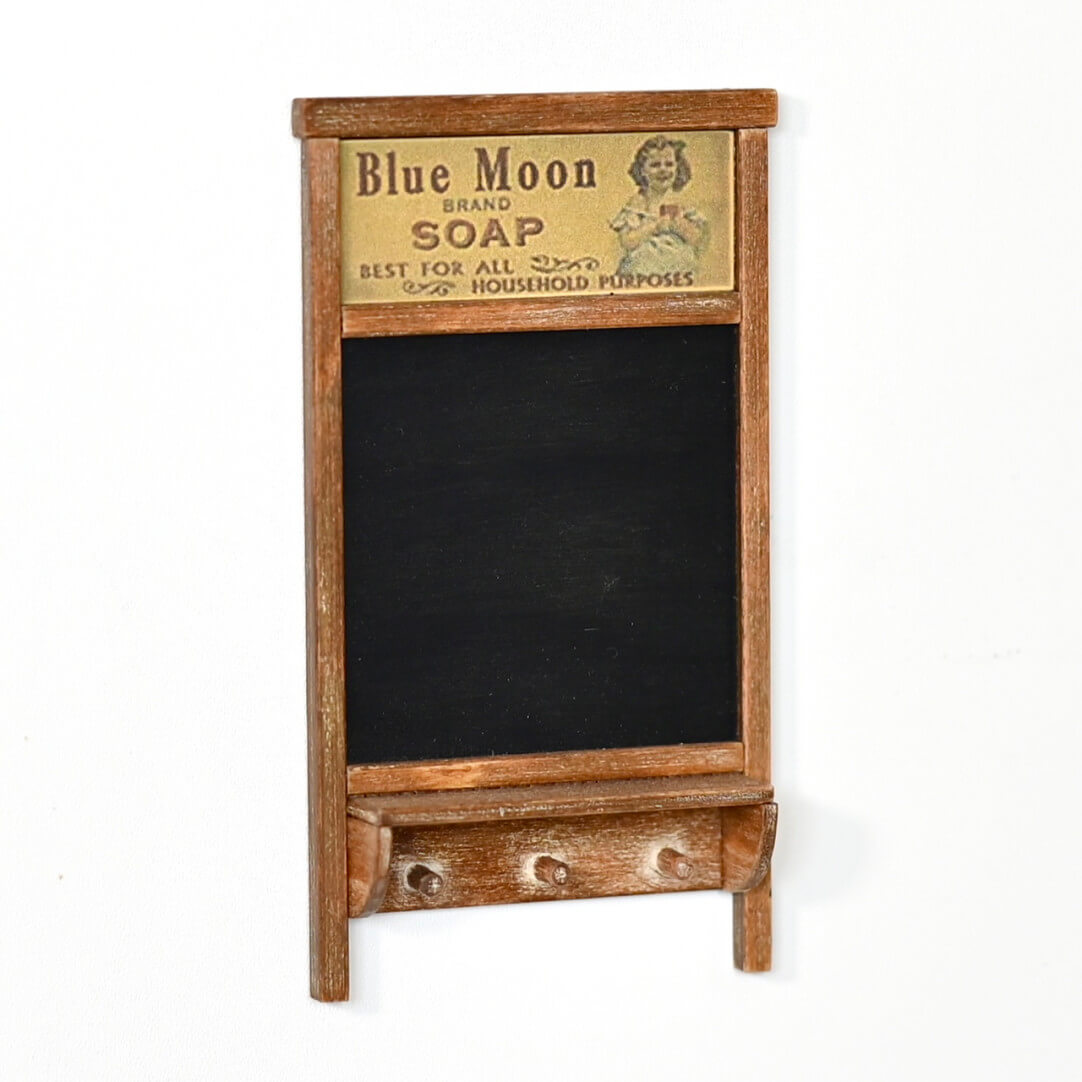 Corral the dollhouse keys, plants and other countertop clutter with this handy miniature Wall Organizer, complete with a chalkboard and hooks. Default Color/ Finish: Black and Brown Style: Shabby Chic Material: Wood Scale: 1/6 (6×10.7cm / 2.36×4.21in)