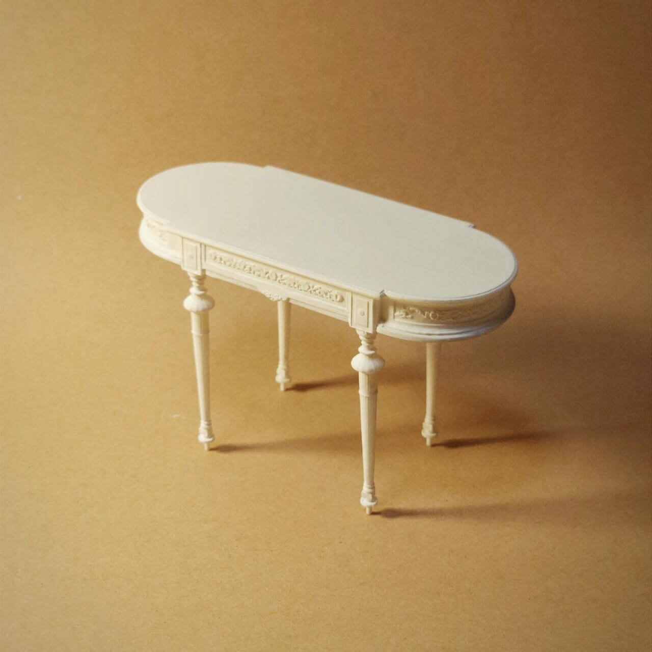 The White Miniature Oval-shaped Dining Coffee Table Dollhouse Furniture is made of Resin with an expression linked to elegance and craftsmanship. Subtle carved details Color/ Finish: White Styles: A classic French inspired design Material: Resin Type: Table Height: 11cm/4.33in