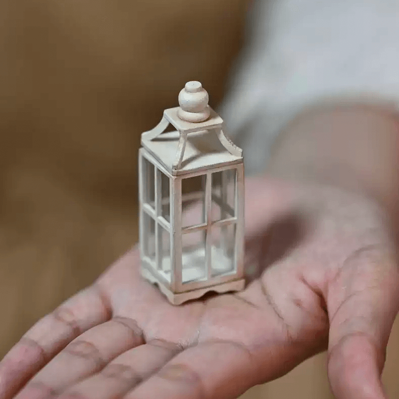 This Miniature Windproof Lantern Candle Holder Kit for Dollhouses is a beautifully designed craft kit perfect for enhancing the charm of any dollhouse or miniature scene. Featuring a realistic windproof design and a detachable top, this lantern adds a cozy, vintage ambiance to dollhouse interiors, patios, or garden settings. Whether you're a crafter, collector, or dollhouse enthusiast, this lantern is a delightful addition that brings warmth and character to your miniature world.