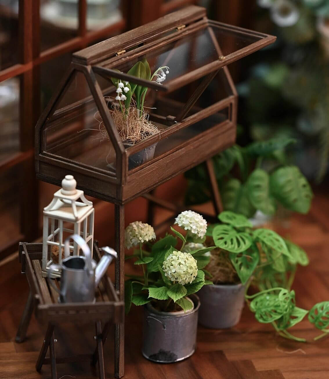 Bring a charming, rustic touch to your dollhouse garden with this Miniature Wooden Greenhouse with Two Doors Kit. This beautifully crafted greenhouse features an openable door design and detailed wooden construction, perfect for displaying miniature plants, flowers, or garden tools. The kit allows you to assemble a functional and decorative piece, adding both style and practicality to your miniature outdoor space.