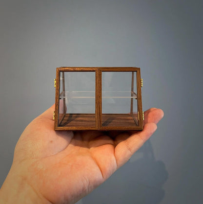 Miniature Walnut Slant Front Shop Store Counter Dollhouse Display Case with two doors and shelve that can be used in any type of store front. Color/ Finish: Cherry wood or Dark walnut Material: Black Walnut wood or Cherry wood Type: Display Case Size: 8×5×5.5cm / 3.15×1.97×2.17in