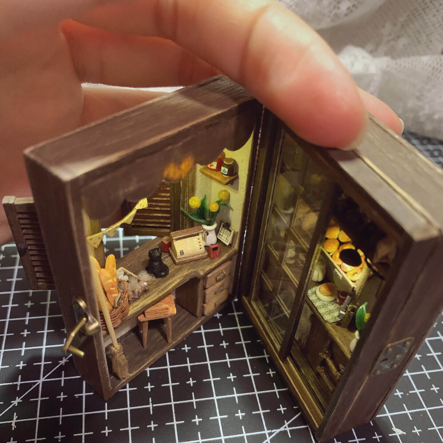 Inspired by "Kiki's Delivery Service" "I’m not quite sure of my direction, but I hope I can go a little further." — "Kiki's Delivery Service" Can be opened, flipped through, and has lights; all small items can be removed. Louvered windows and sliding doors.