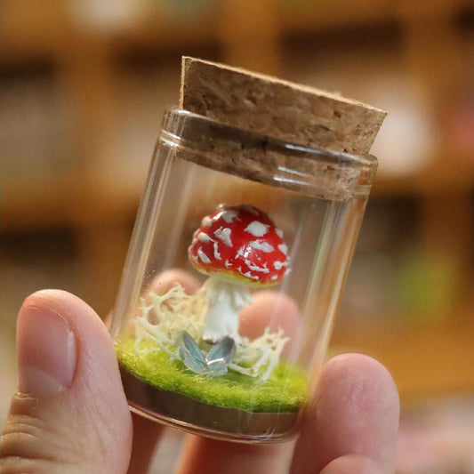 Bring a touch of magic to your space with our adorable Miniature Mushroom nestled in a charming glass jar! This enchanting piece creating a serene atmosphere perfect for any dollhouse room or garden.