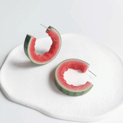 This listing is for 1 pair of C shaped watermelon stud earrings. Cute realistic watermelon stud earrings with sterling silver studs. The watermelon are made with polymer clay and then finished with a gloss varnish. The earrings are made from high-quality materials and are durable, but should not be put in aggressive environments like excessive moisture, chemicals or perfume.