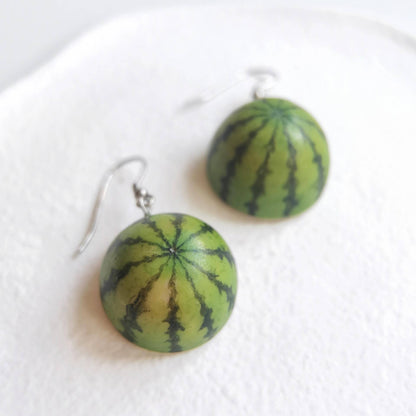 This listing is for 1 pair of half watermelon hook earrings. Cute realistic half watermelon hook Earrings with sterling silver hook. The watermelon are made with polymer clay and then finished with a gloss varnish. The earrings are made from high-quality materials and are durable, but should not be put in aggressive environments like excessive moisture, chemicals or perfume.