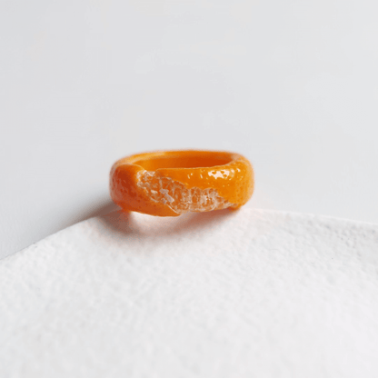 Cute realistic tangerine half-peeled ring are made with sterling silver or gold plated and polymer clay and then finished with a gloss varnish. The ring are made from high-quality materials and are durable, but should not be put in aggressive environments like excessive moisture, chemicals or perfume.