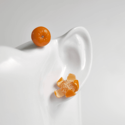 Cute realistic whole and peeled tangerine stud earrings with sterling silver studs. The tangerine are made with polymer clay and then finished with a gloss varnish. The earrings are made from high-quality materials and are durable, but should not be put in aggressive environments like excessive moisture, chemicals or perfume.